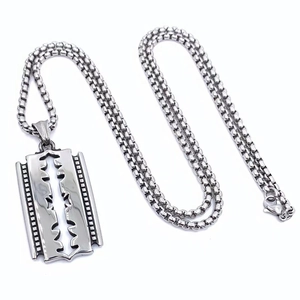 Close-up of hip-hop razor blade pendant with polished stainless steel surface and bead chain