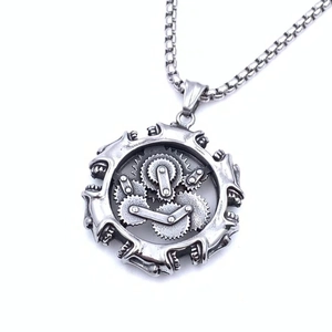 Macro shot of steampunk mechanical gear pendant necklace in vintage silver steel