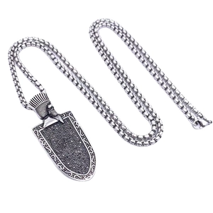 Vintage steel necklace with a crowned Spartan shield pendant and black gemstones