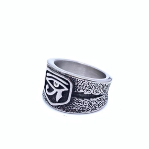 Macro detail of vintage Horus Eye ring with black oxidation and rock texture finish