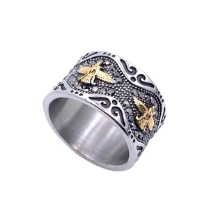 Bague large vintage en acier inoxydable avec aigles dorés et gravures florales