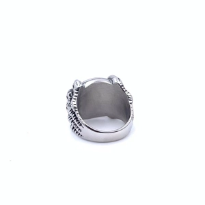 Macro side view showing intricate dragon claw carvings on this vintage punk steel ring