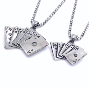 Macro view of vintage stainless steel royal flush poker pendant with square pearl chain
