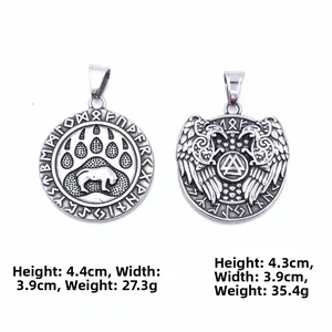 Detailed view of Nordic Viking pendants featuring bear paw and Valknut symbols on white background