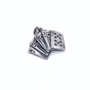 Macro detail of royal flush poker pendant in retro silver finish for hip hop necklace