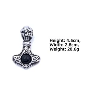Detail view of Mjolnir pendant with skull design and dimensions 4.5cm by 2.8cm