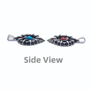 Side view detail of Gothic punk titanium steel pendants with red and blue gemstone inlays