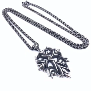 Retro gothic cross pendant necklace in titanium steel with intricate vine carvings