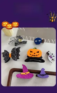 Detailed set of 7 Halloween hair clips featuring pumpkin, ghost, and bat wing designs
