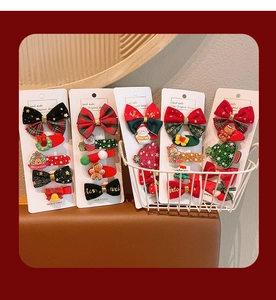 Christmas hair clips set featuring red velvet bows, snowman, and reindeer on card