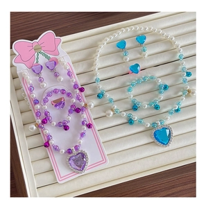 Detailed set of beaded jewelry for girls with heart pendants, rings, and clip-on earrings