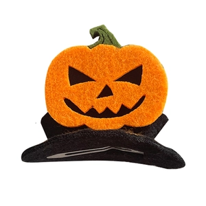 Halloween pumpkin ghost hair clip with orange felt and black facial expression cutout