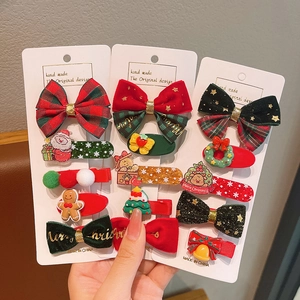 Christmas hair clips set featuring red velvet bows and festive cartoon characters