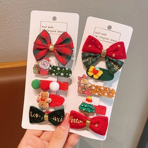 Christmas hair clips set for girls featuring red bows and Santa Claus festive hair accessories