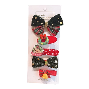 Christmas hair clips set featuring red bows, reindeer, and festive bells for girls