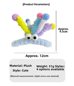 Détail de la pince à cheveux monstre en peluche avec tiges colorées et grands yeux