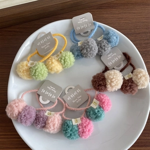 Cute colorful pom pom hair ties set for girls featuring soft plush balls in macaron colors