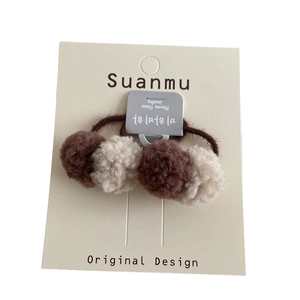 Cute plush pompom hair tie for girls featuring chocolate and cream balls on elastic band