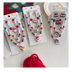 Detailed close-up of colorful Christmas themed jewelry sets for kids with beaded designs