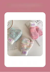 Close-up of winter knitted mittens with ribbed cuffs and soft fleece lining for toddlers