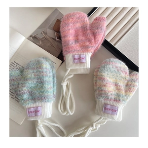 Detailed view of thick knitted infant mittens with lanyards in three pastel colorways