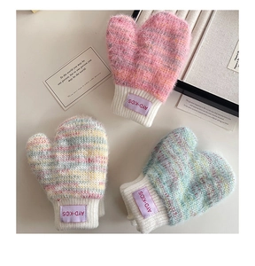 Detailed view of three pairs of thick plush knit mittens for babies in various mixed colors