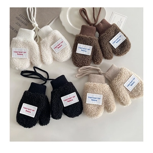 Flat lay of colorful children's fleece mittens with neck cord and embroidered letter patch