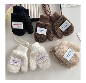 Detailed view of plush sherpa fleece mittens for children in four neutral colors