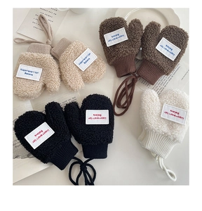 Close-up of plush fleece toddler mittens with letter patch and hanging neck rope detail