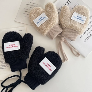 Toddler fleece mittens with neck cord in black and cream featuring stylish letter patches