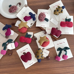 Handmade fabric hair clips and ties in cute fruit and forest shapes for young girls