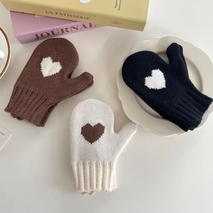 Cozy knit heart pattern mittens for kids in brown, black, and beige colors
