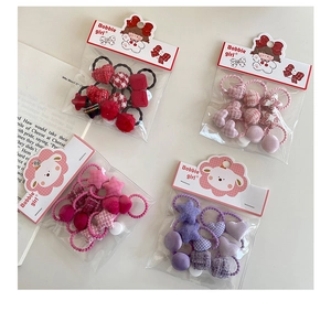 Détail des élastiques à cheveux pour filles avec motifs de cœur et d'étoile variés