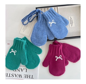 Detailed plush knit mittens for girls with 3D white bows and functional neck straps