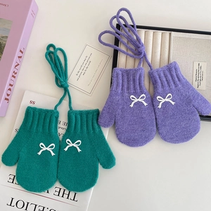 Winter knitted mittens for girls with sweet bow design in green and purple colors
