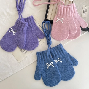 Winter warm knitted gloves for girls featuring sweet bow ties and hanging neck ropes