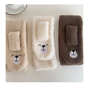 Detailed view of plush winter scarf sets with cute bear embroidery in three colors