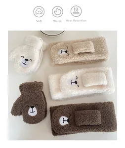 Detailed view of warm lamb velvet winter accessories with soft bear face embroidery