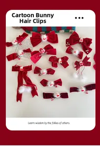 Detail of red festive bow hair clips with plush pom-poms and Chinese New Year motifs