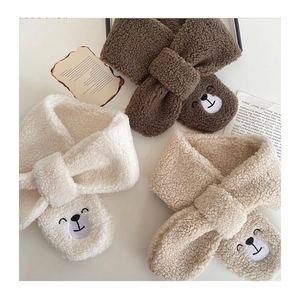 Close-up of children's fleece neck warmer with cute bear embroidery in three warm colors