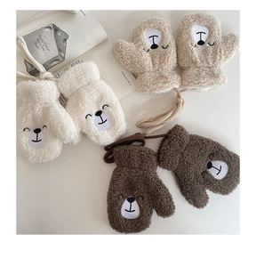 Detail of warm plush bear mittens for kids in beige and brown with neck strings