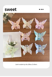 Vue détaillée de huit couleurs irisées de pinces à cheveux en forme de papillon