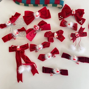 Red bow hair clips for girls with cute white rabbit charms and fluffy pom poms