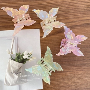 Lot de quatre pinces à cheveux papillon irisées en rose, blanc, violet et vert
