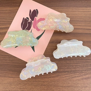 Iridescent mermaid-pearl cloud hair claws in assorted pastel colors for long hair styling
