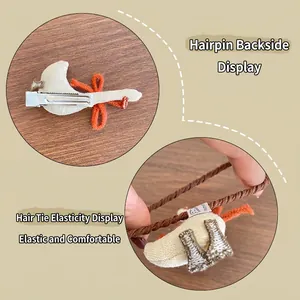 Cute fabric goose hair clip and hair tie set with orange bow in minimalist Korean style
