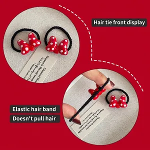 Red polka dot bow hair ties for girls with high elastic black bands and resin design