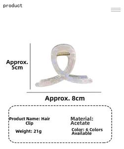Vista dettagliata della pinza per capelli in acetato perlato con dimensioni 8 cm per 5 cm