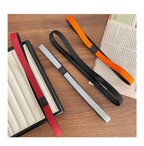 Detail view of colorful non-slip elastic sports headbands for yoga and running on a desk