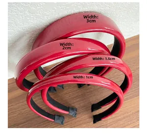 Detail view of four red faux leather headbands in widths of 1cm, 1.5cm, 2cm, and 3cm